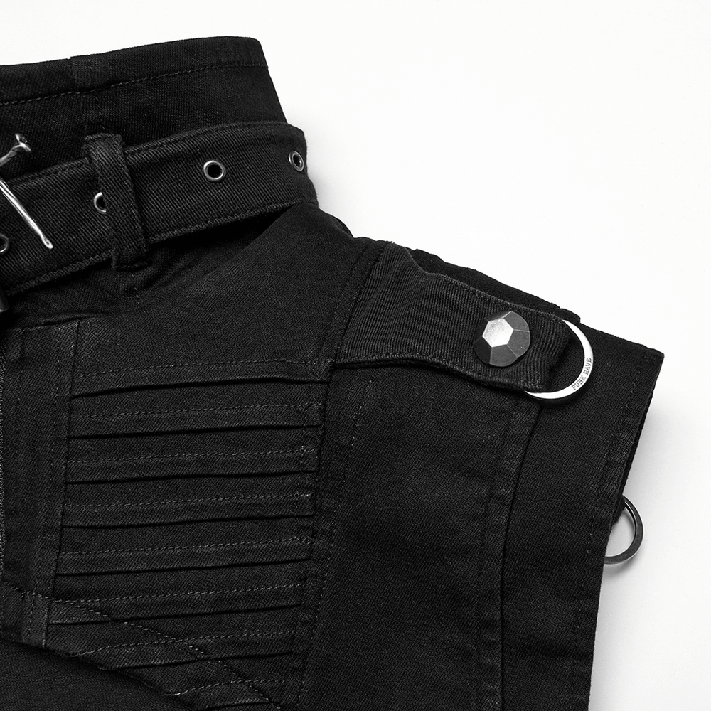 Close-up of a gothic punk black denim shoulder cape with studs and unique design details.