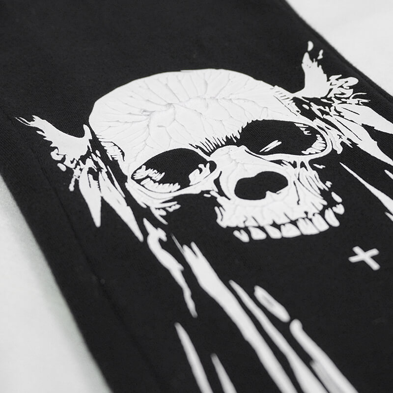 Close-up of a black fabric featuring a stylish white skull print, ideal for gothic punk leggings.