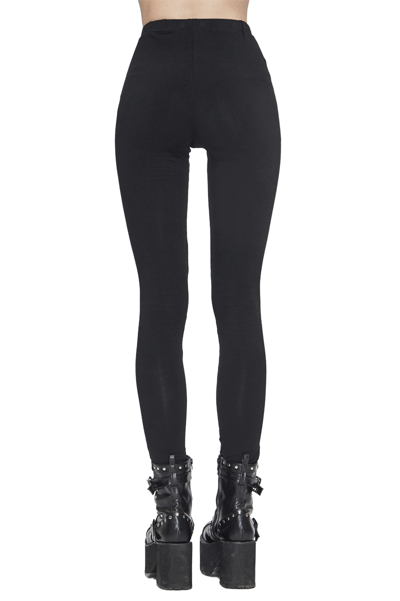 Rear view of women's black Gothic punk leggings, featuring a stylish fit and paired with edgy platform boots.