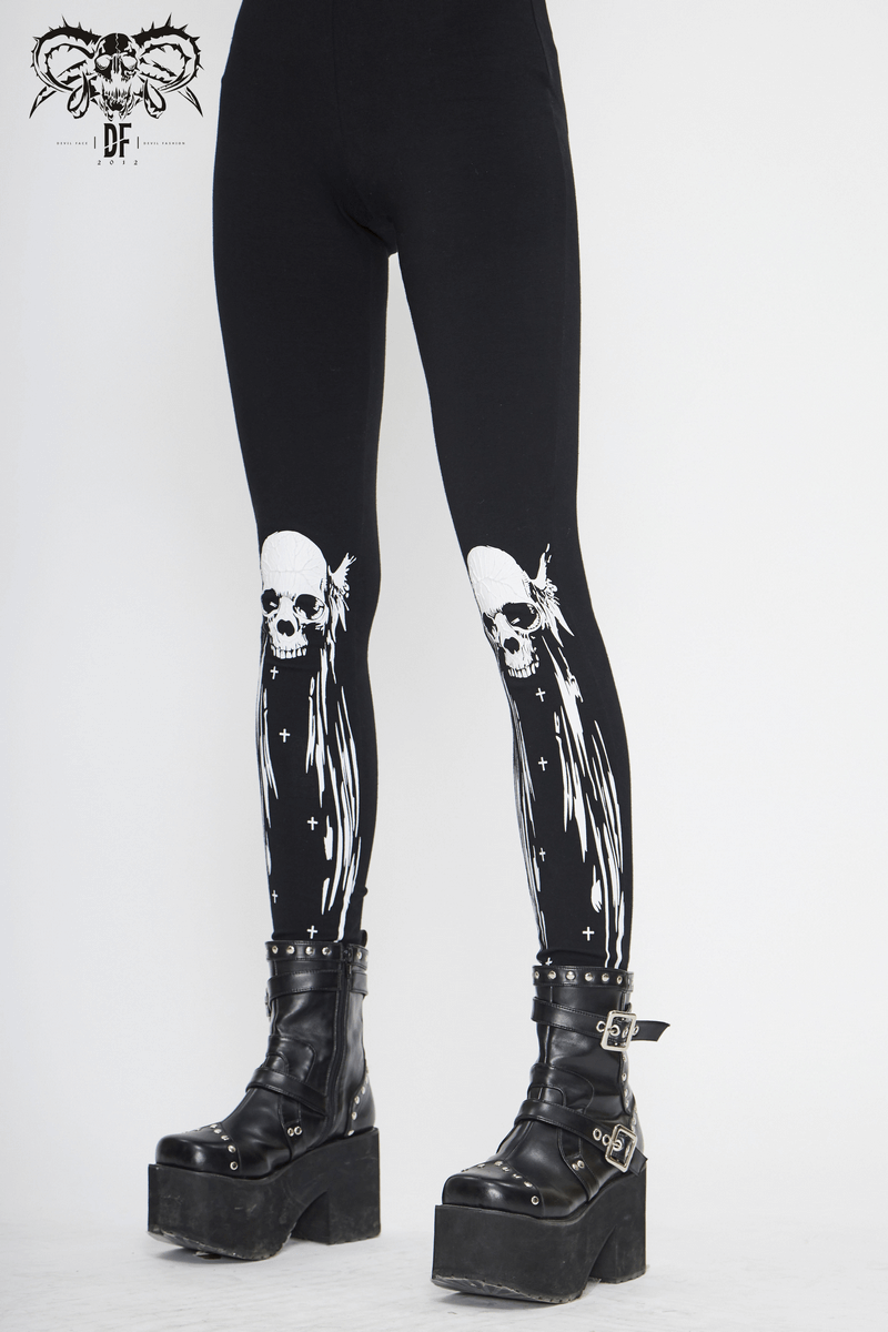 Stylish women's black leggings with white skull print, perfect for a punk alternative fashion statement.
