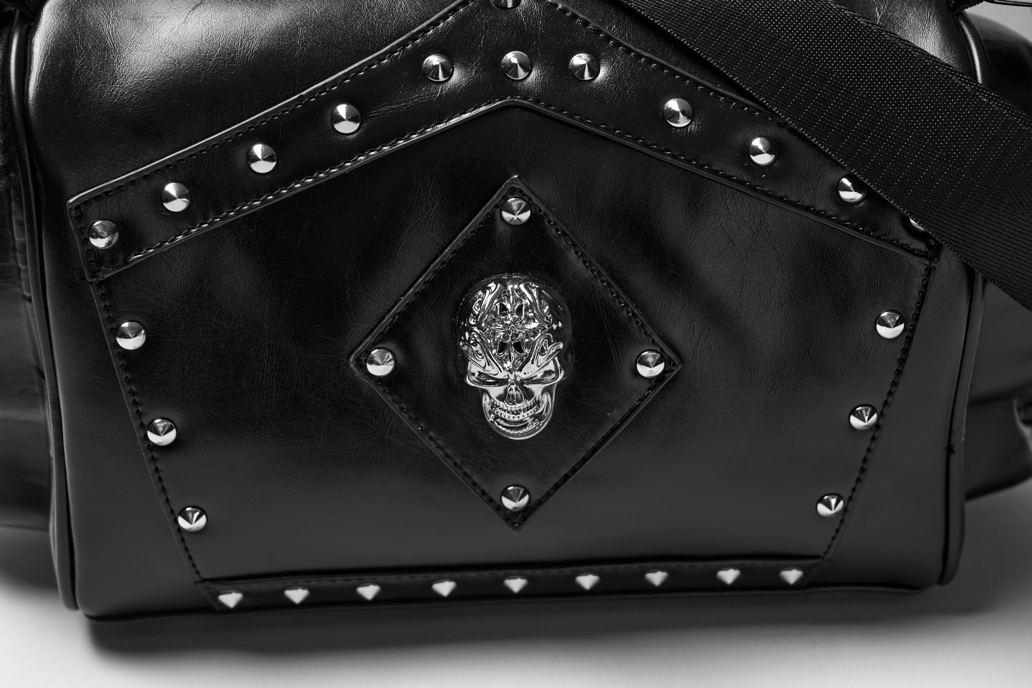 Close-up of Gothic Punk Coffin Skull Shoulder Bag with rivets and skull detail, showcasing eco-friendly leather.