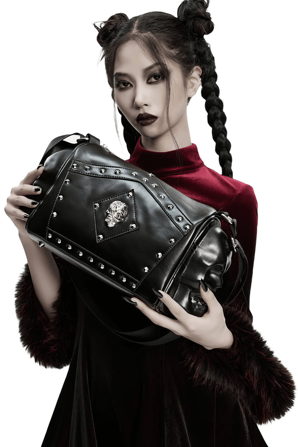 Gothic punk coffin skull shoulder bag with rivets, showcased by a model in dark fashion attire.