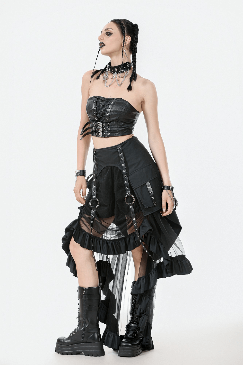 Gothic punk model in faux leather corset top with lace-up details and layered black skirt, showcasing edgy alternative fashion.