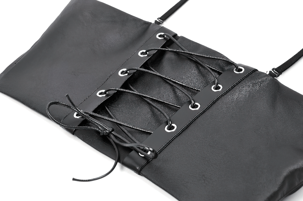 Close-up of a gothic punk faux leather corset top featuring lace-up detail and eyelets.