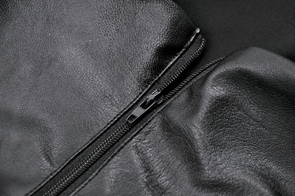 Close-up of a sleek black leather zipper, showcasing texture and detail for a gothic punk aesthetic.