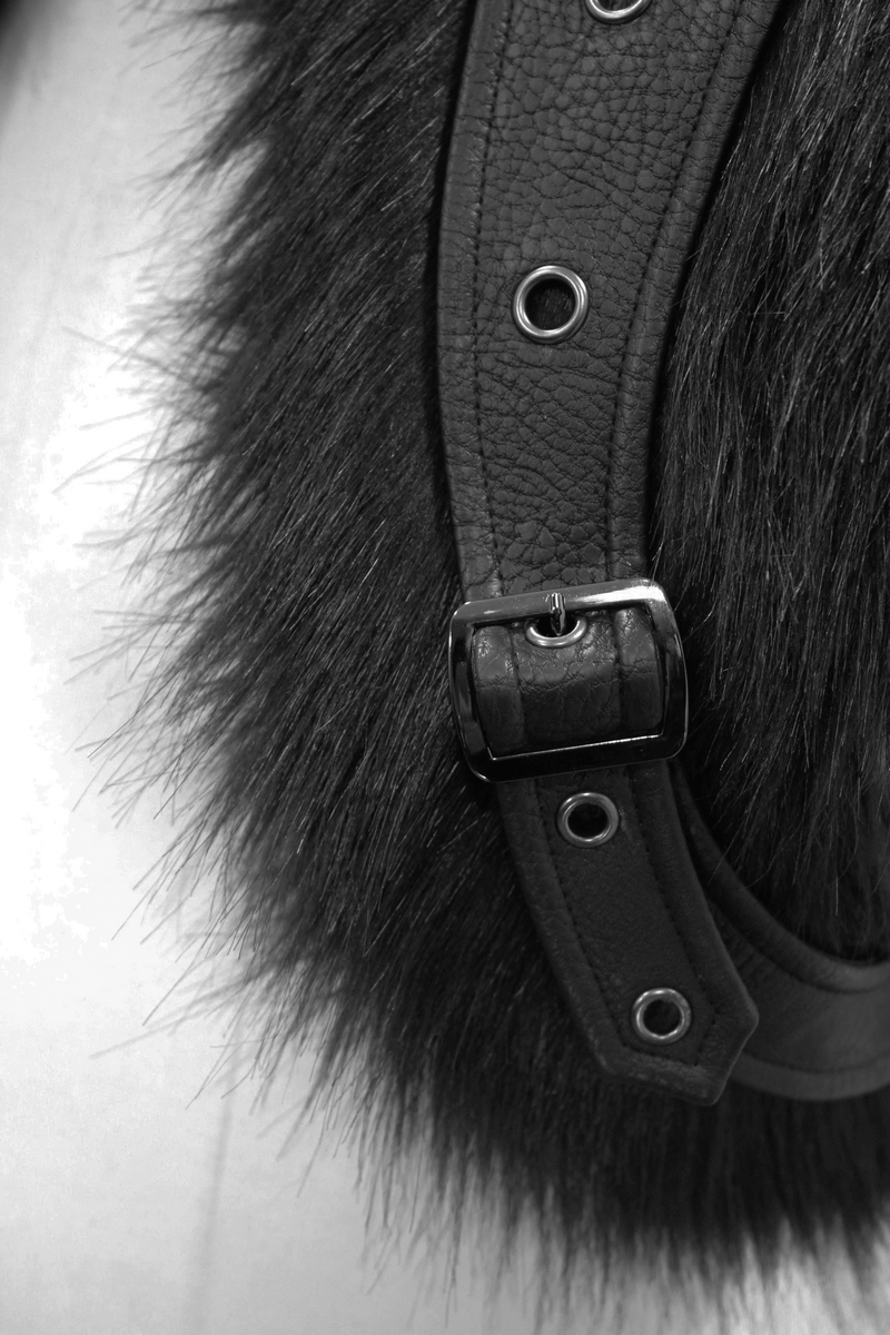 Close-up of black fur and leather strap detail on a gothic punk coat.