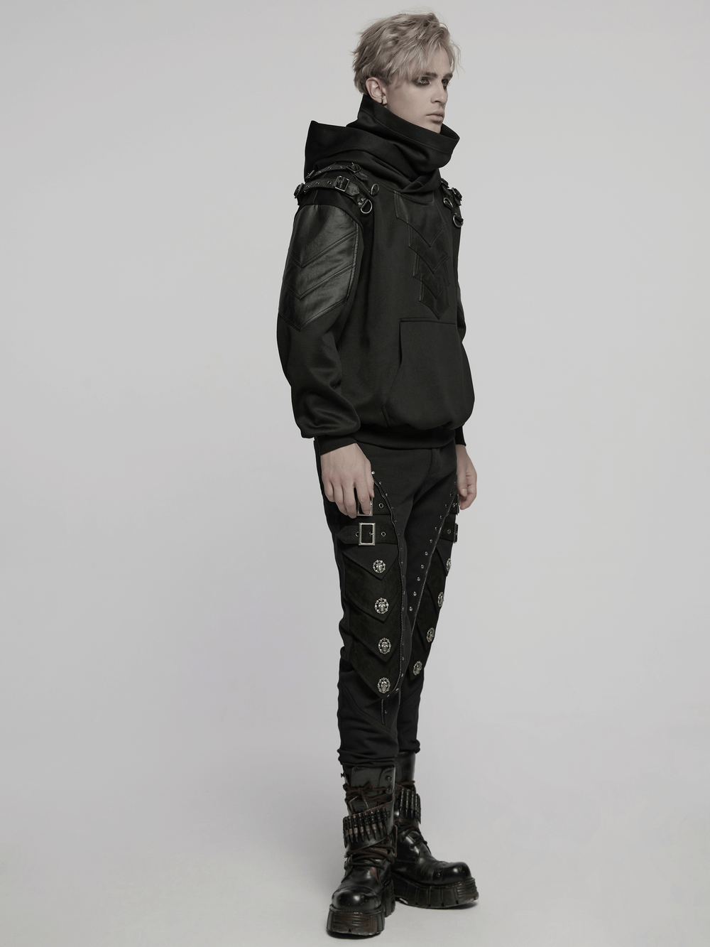 Gothic punk hoodie with armor elements and decorative shoulder loops, styled with edgy black pants and boots.