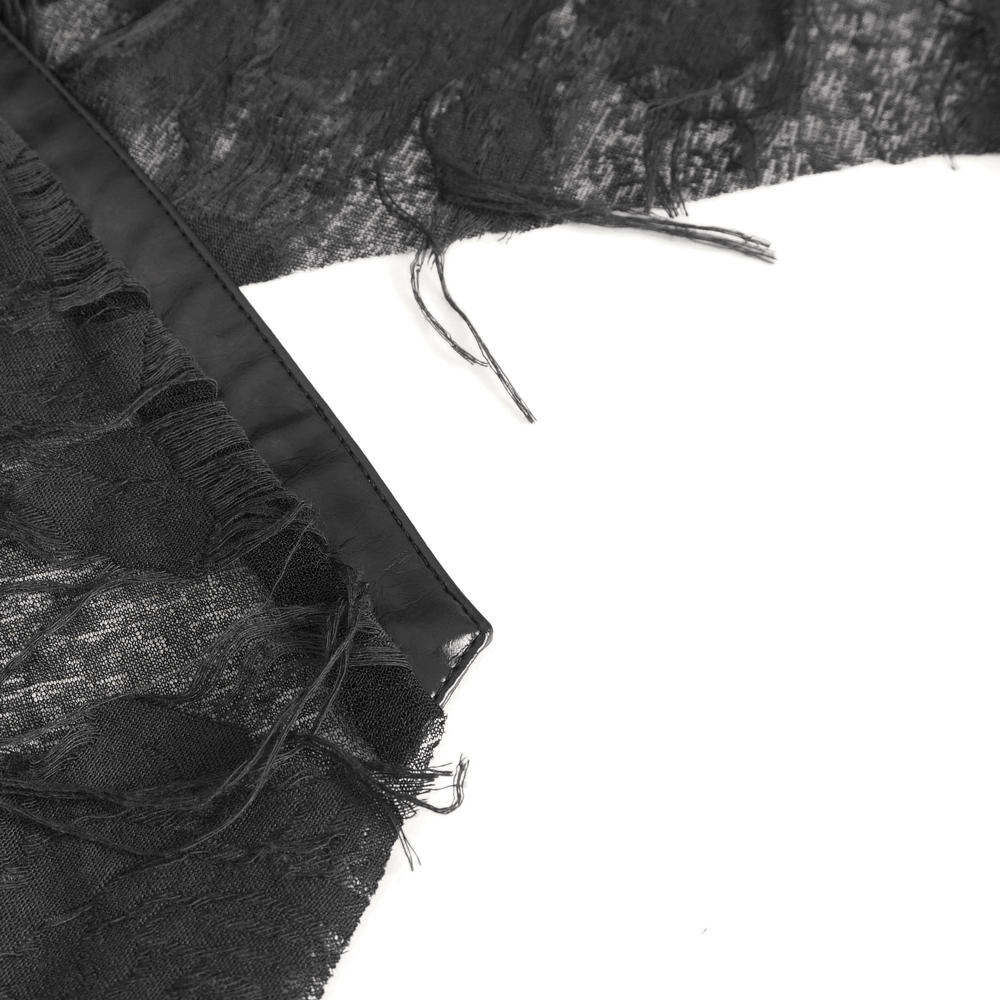 Close-up of the irregular black ripped fabric showcasing intricate texture and dramatic fraying details.