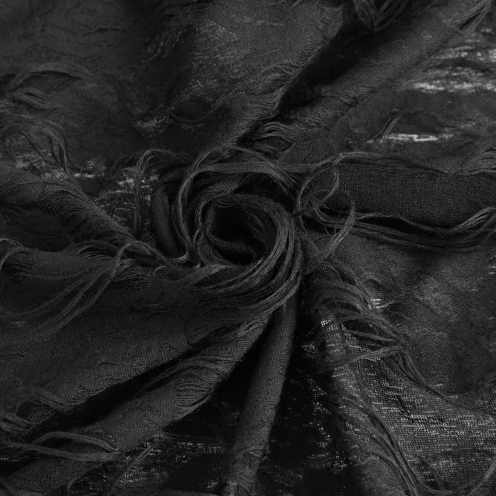 Close-up of black ripped fabric showcasing a textured, frayed design perfect for gothic fashion dress.