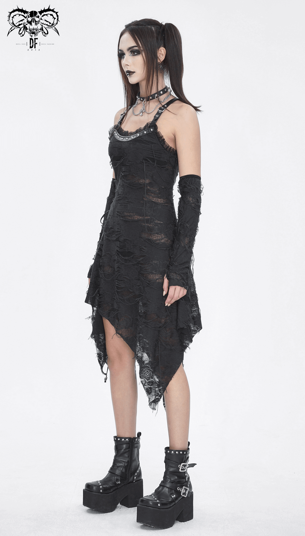 Gothic punk black ripped dress with long gloves, asymmetrical hem and chunky boots, perfect for edgy fashion lovers.
