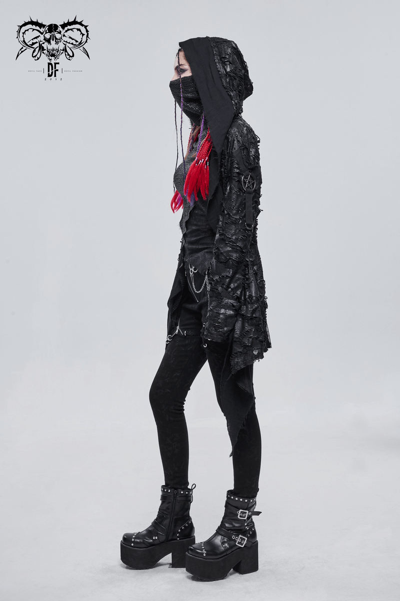 Women in a gothic punk irregular hooded trench coat styled with a metal pentagram, black outfit, and chunky platform boots.