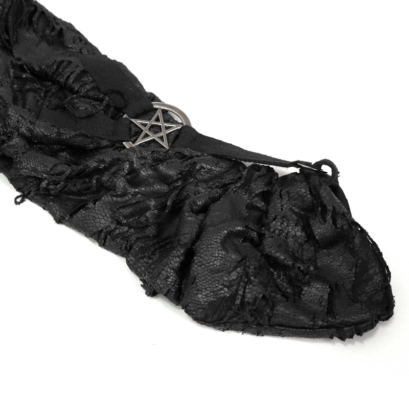 Close-up of black irregular hooded trench coat with textured fabric and metal pentagram embellishment.