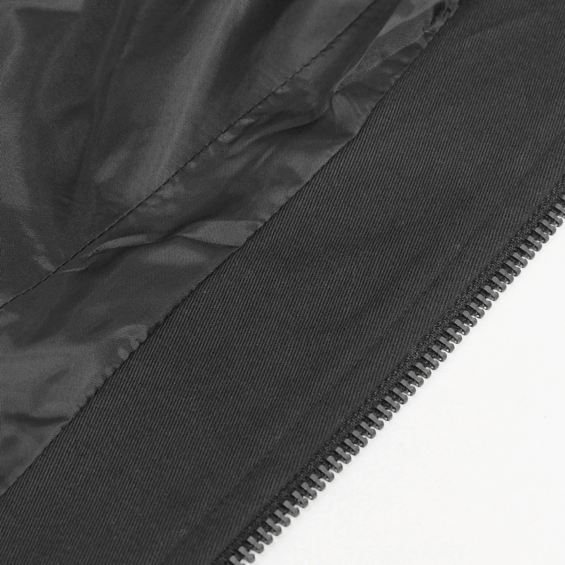 Close-up of the black interior of a gothic punk jacket featuring a zipper detail.