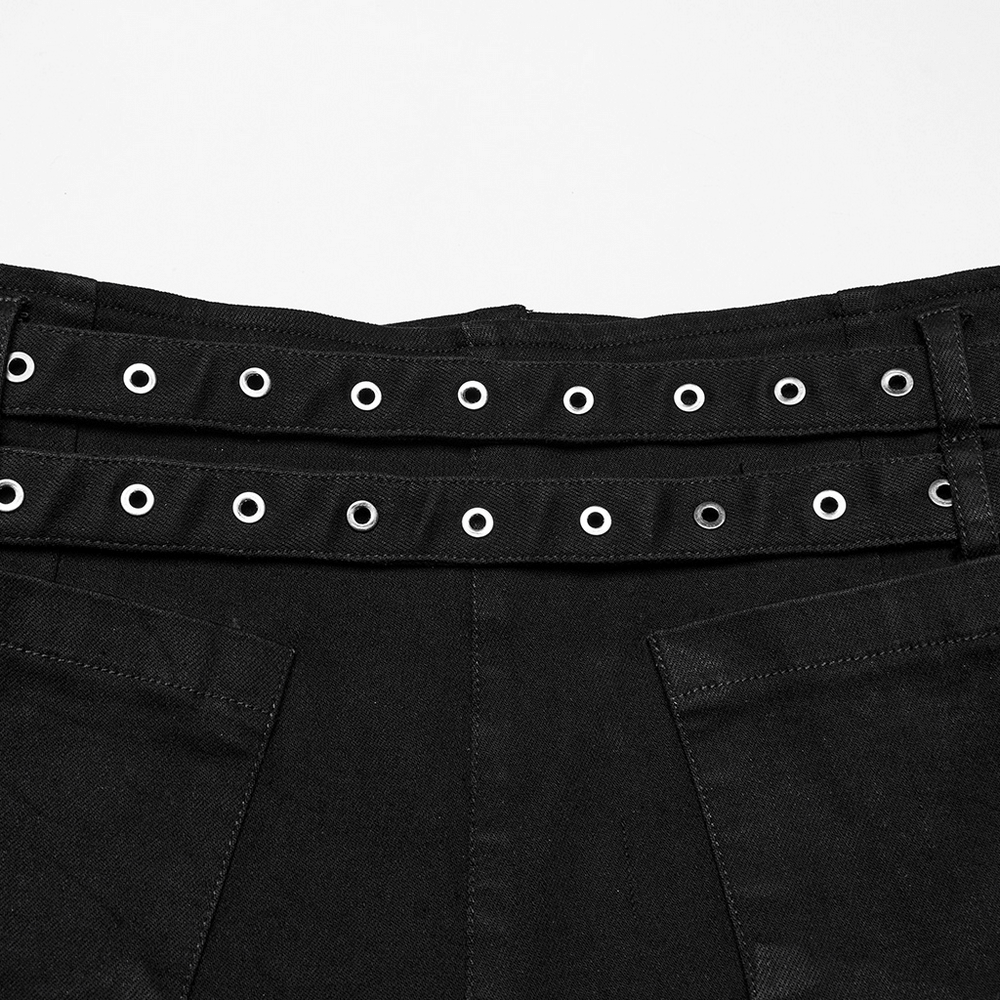Close-up of gothic punk black denim shorts with double belt loops and silver eyelet details.