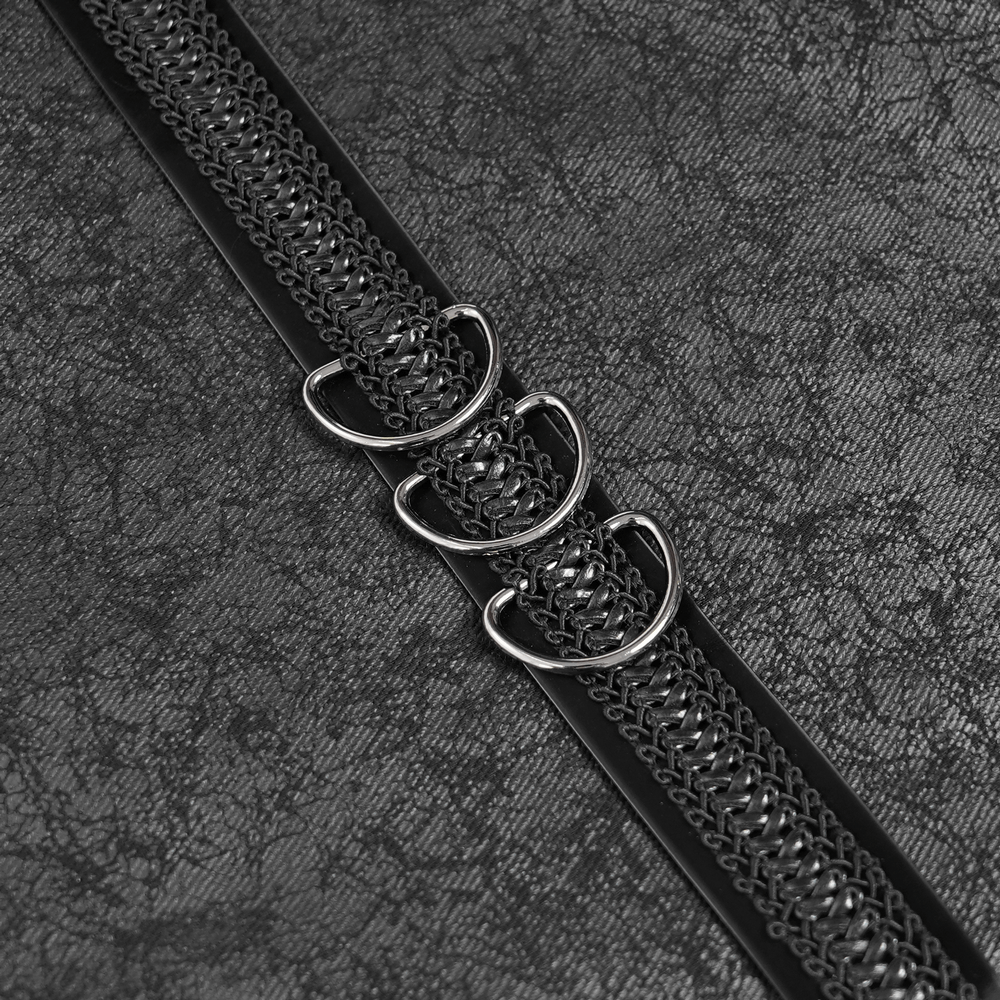 Gothic Punk Layered Strap Skirt with Zippers and Rings metal hardware detail close-up on textured black fabric.