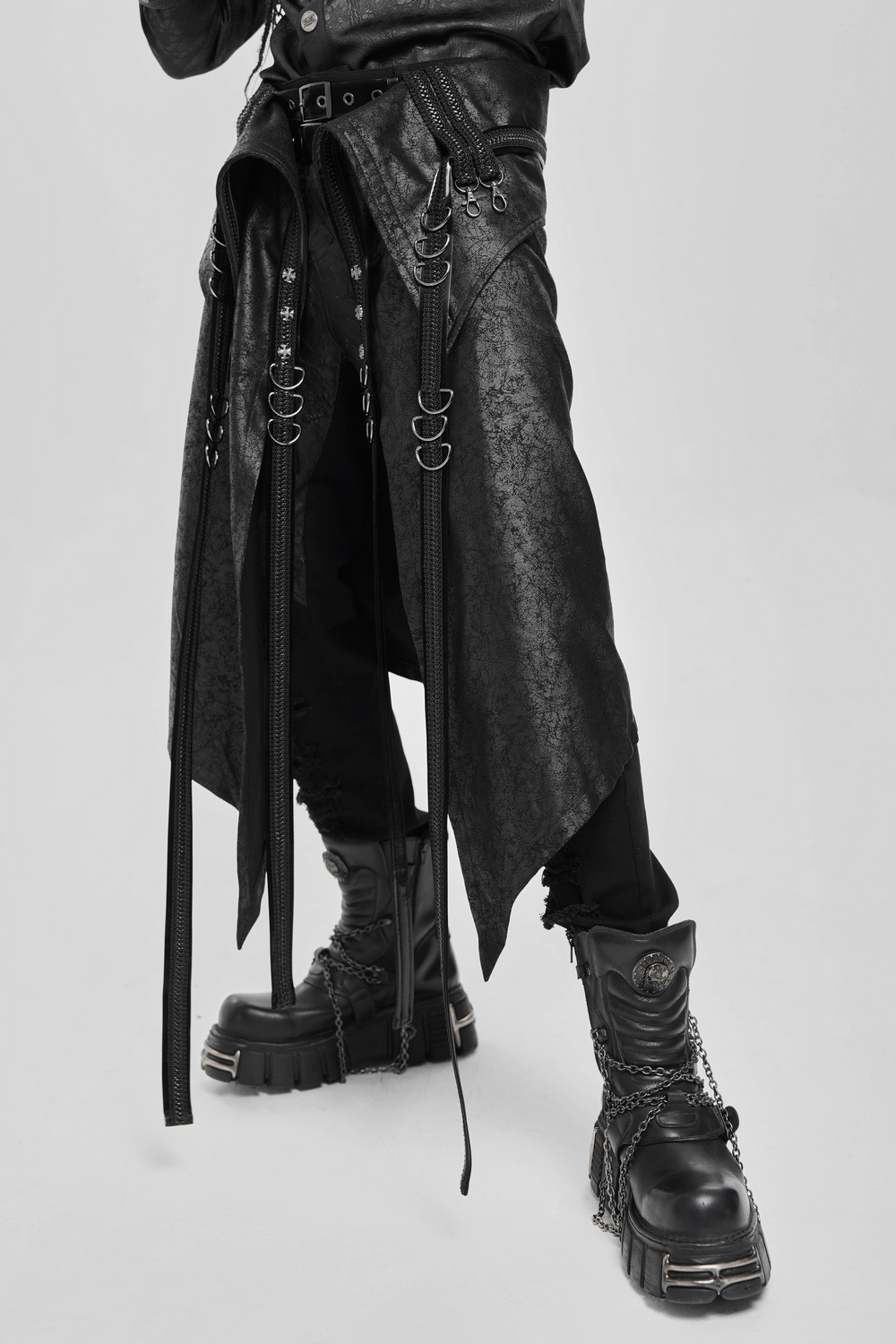 Gothic Punk Layered Strap Skirt with Zippers and Rings featuring metal details and paired with chunky platform boots.