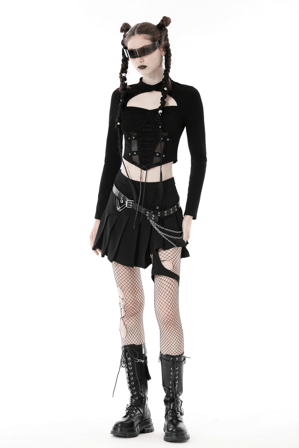 Edgy model showcasing black mesh crop top with lace-up front and punk style accessories, perfect for gothic fashion.