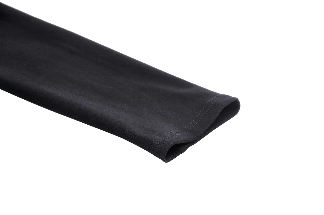 Close-up of the long sleeve of a black mesh punk crop top showcasing its sleek design and edge.