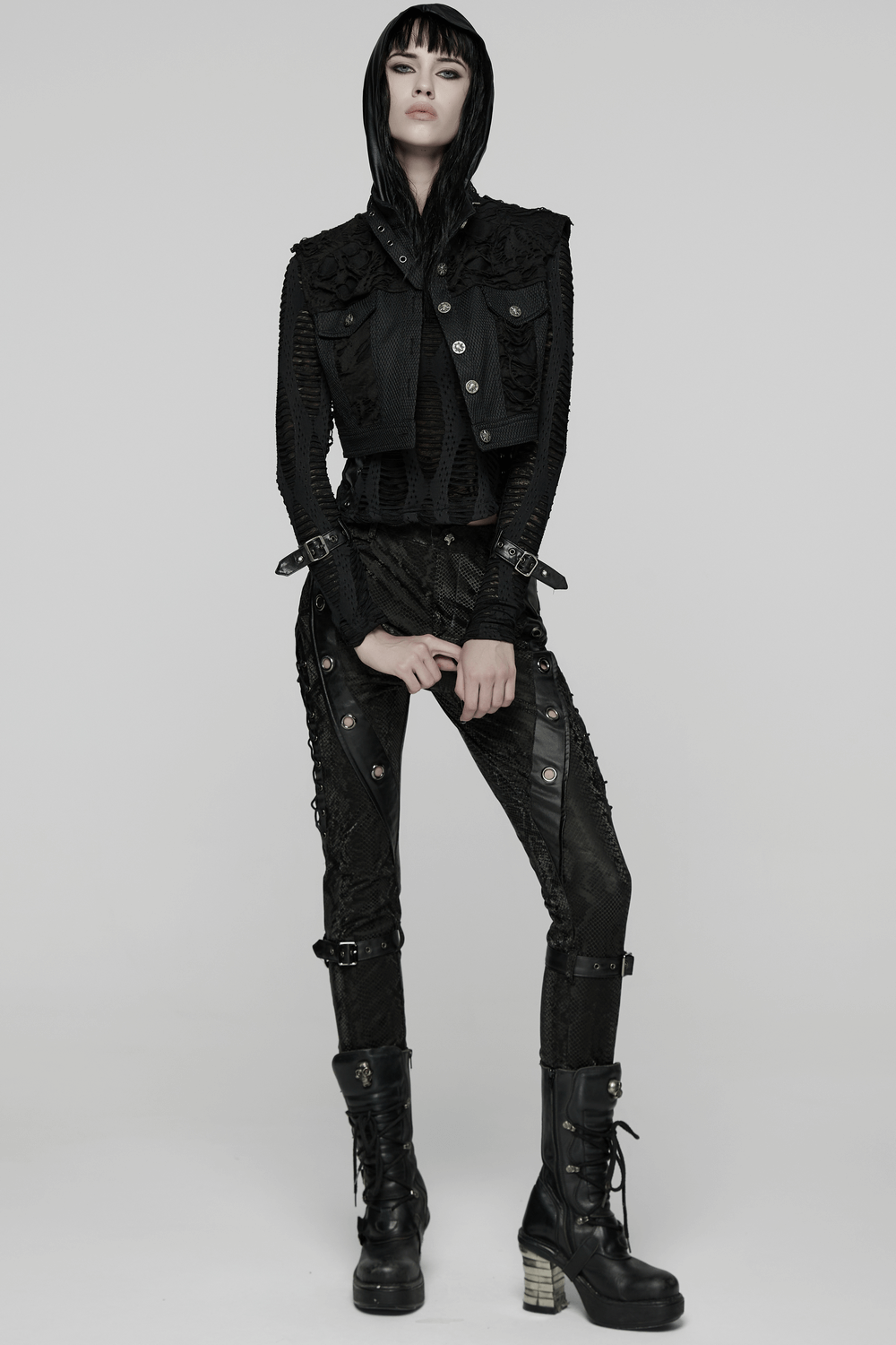 Gothic Punk Mesh Short Vest with Skull Buttons worn by a model in a stylish black outfit featuring edgy textures.