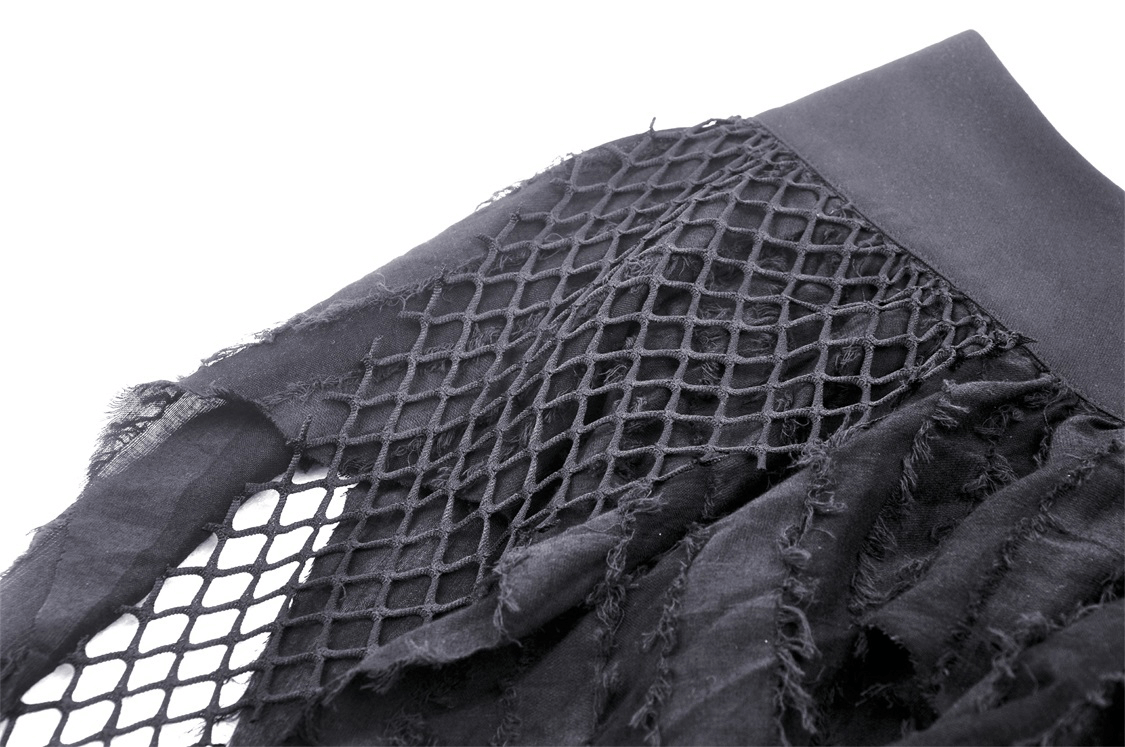 Close-up of black Gothic punk mini skirt featuring ripped fishnet and raw fringe accents.