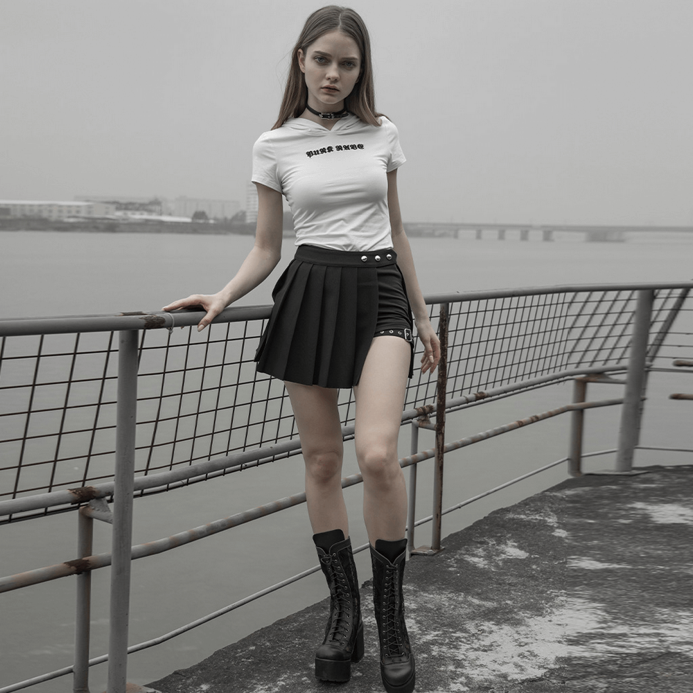 Gothic punk model in asymmetrical plaid mini skirt with button details, showcasing a Harajuku-inspired style near the water.