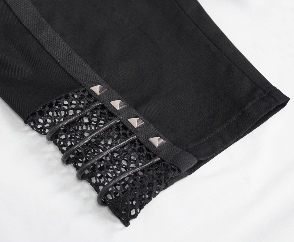 Close-up of Gothic punk mesh black shorts featuring silver rivets and unique rope detailing.