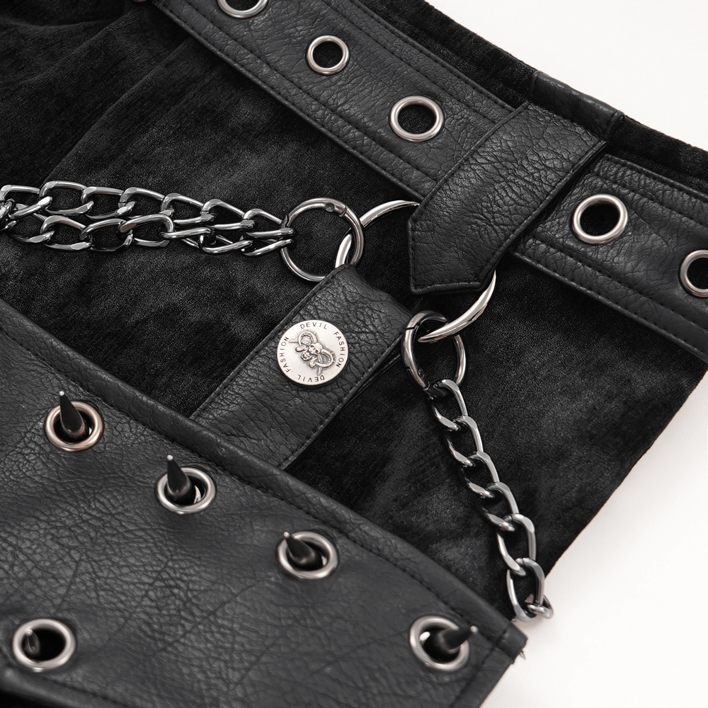 Close-up of a gothic punk skirt detailing chains, leather accessories, and metal eyelets for an edgy look.