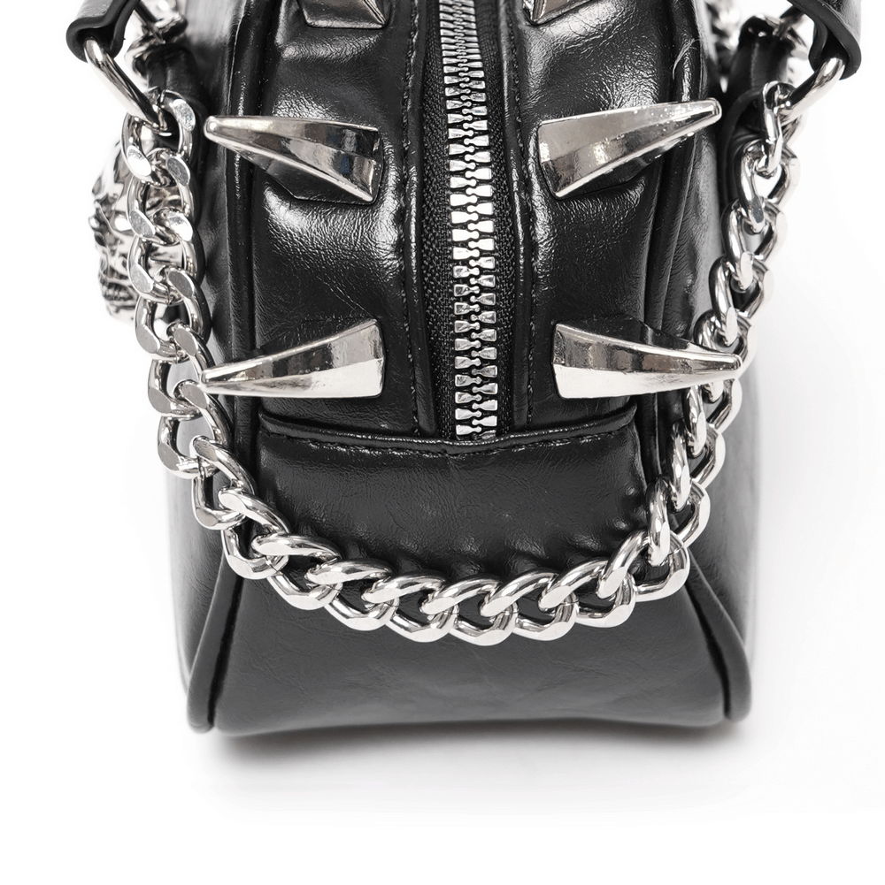 Gothic punk skull handbag with spikes and chain strap, showcasing edgy design and silver embellishments.