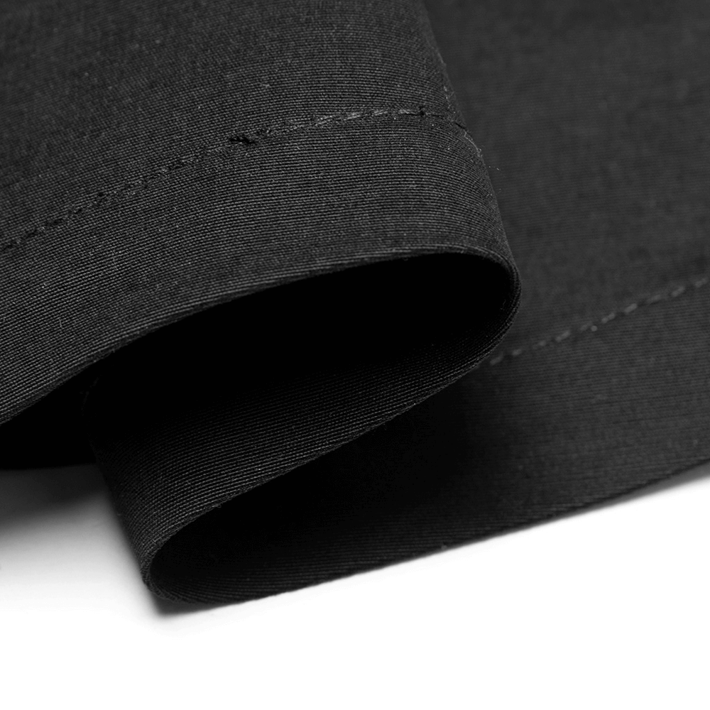 Close-up of luxurious black fabric showcasing smooth edges and precise stitching for Gothic punk dress.