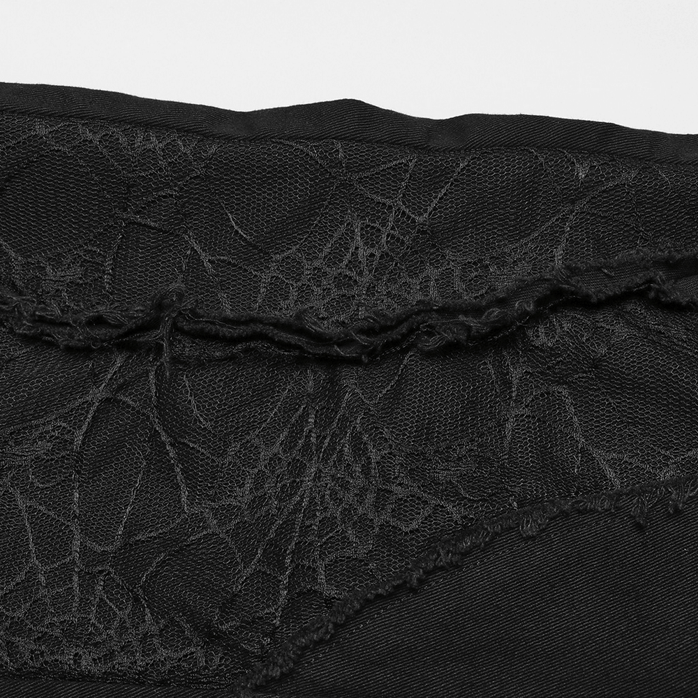 Close-up of Gothic Punk Spider Mesh Panel featuring intricate black web design on edgy pants.