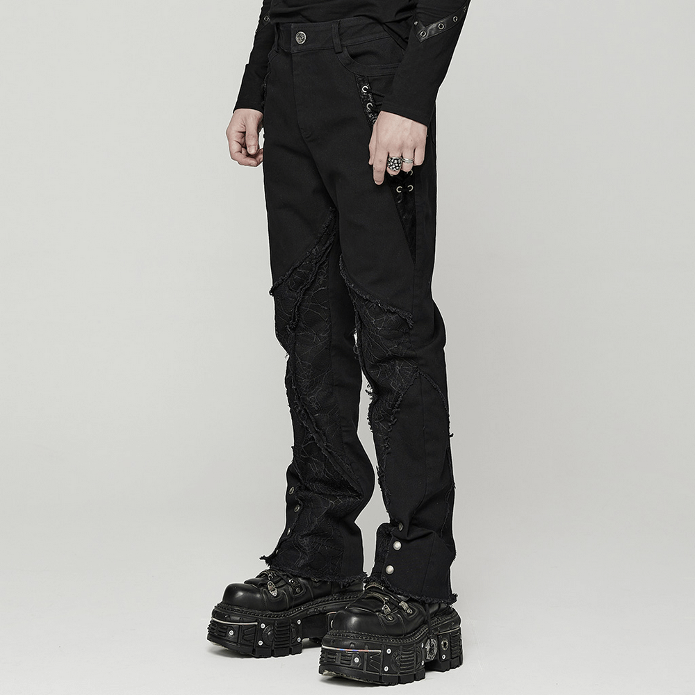 Gothic punk spider mesh paneled pants with eyelets in black, stylish urban wear for edgy fashion lovers.