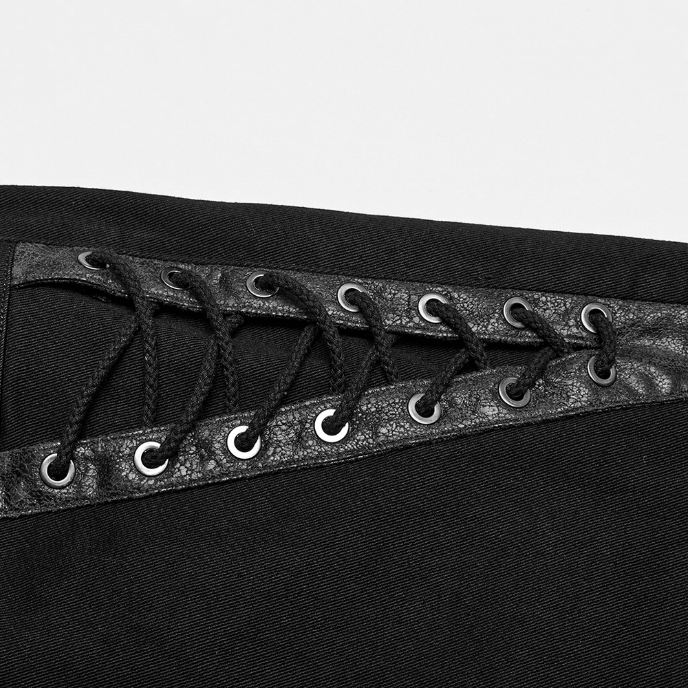 Close-up of Gothic Punk Spider Mesh Pants featuring eyelet detailing and black cracked leather accents.