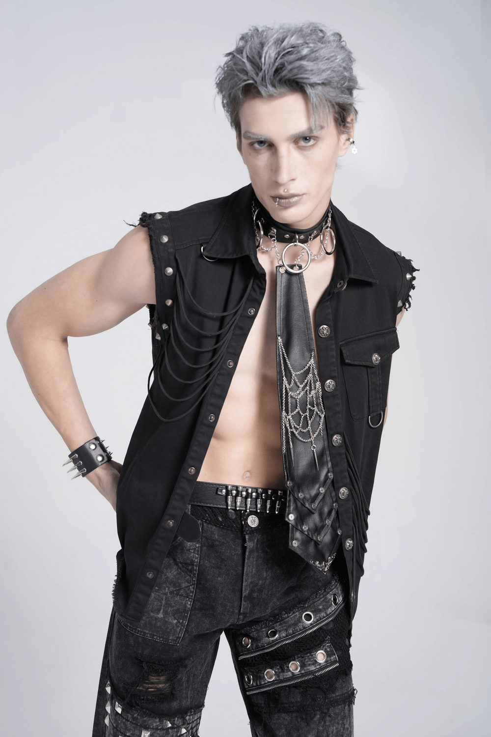 Men's gothic punk model showcasing a black spider web chain necktie and edgy accessories, exuding dark elegance.