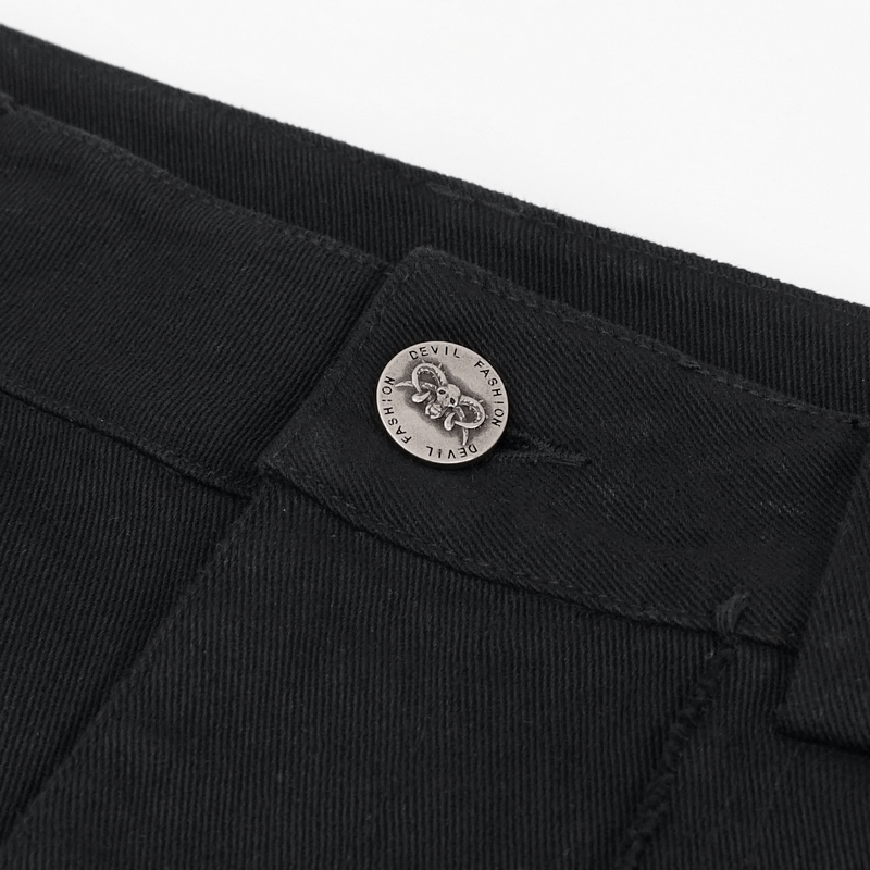 Close-up of black trousers waistband featuring a decorative metal button for a punk style look.