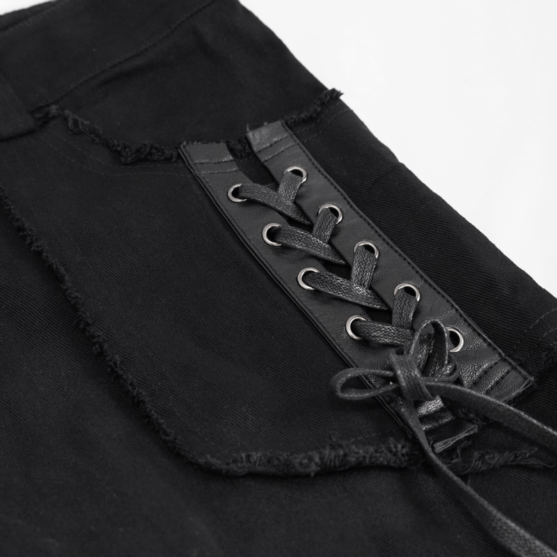 Close-up of gothic punk black trousers featuring unique lacing detail, perfect for trendy men's fashion.