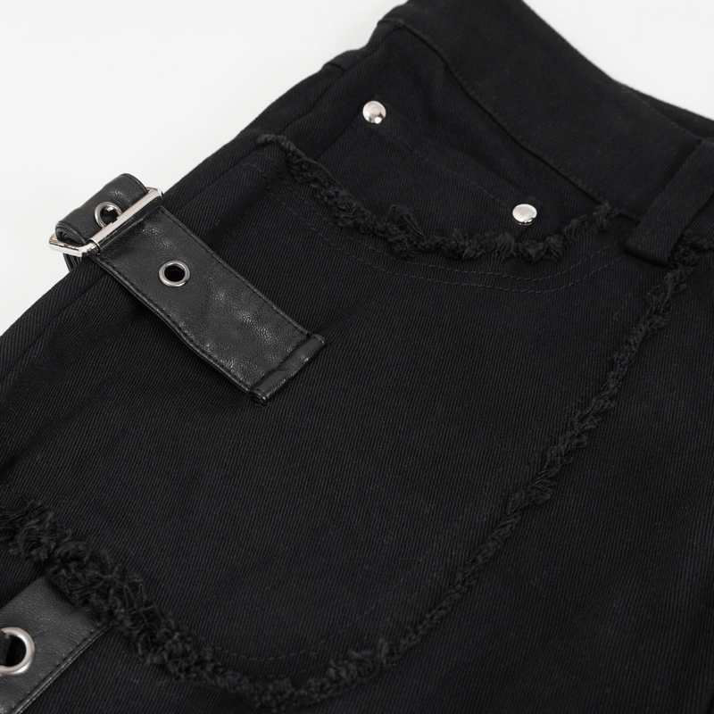 Close-up of black gothic punk trousers featuring lacing detail and a stylish buckle belt.