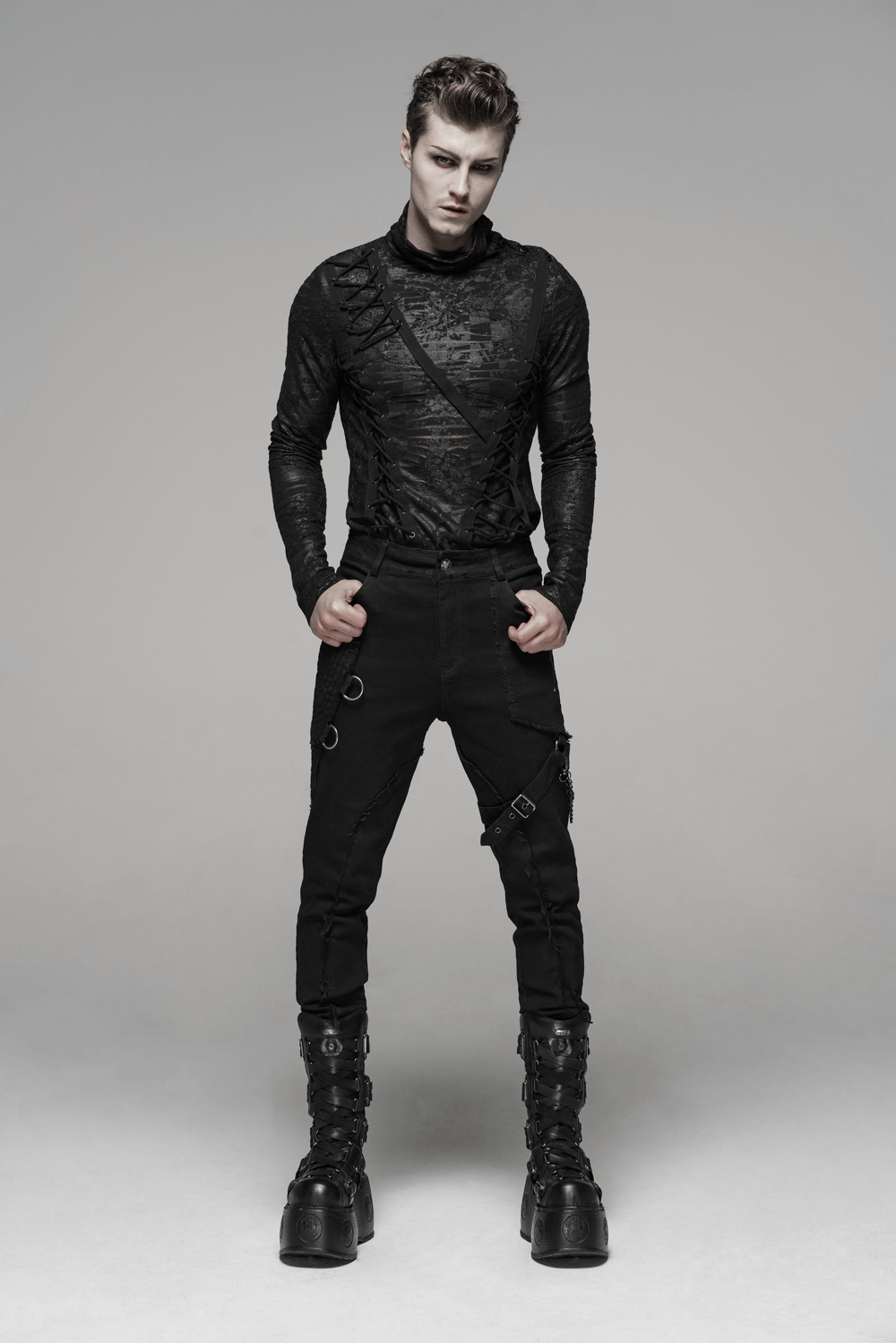 Model showcasing Gothic Punk-Style black cargo pants with chains, zippers, and textured design for an edgy look.