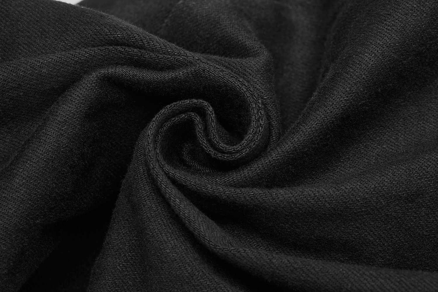 Close-up of soft black fabric, highlighting its stretchy, textured weave perfect for gothic punk-style pants.