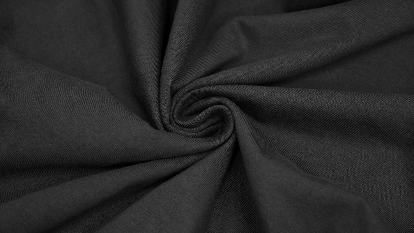 Close-up of soft black fabric showcasing its texture, perfect for gothic punk style clothing.