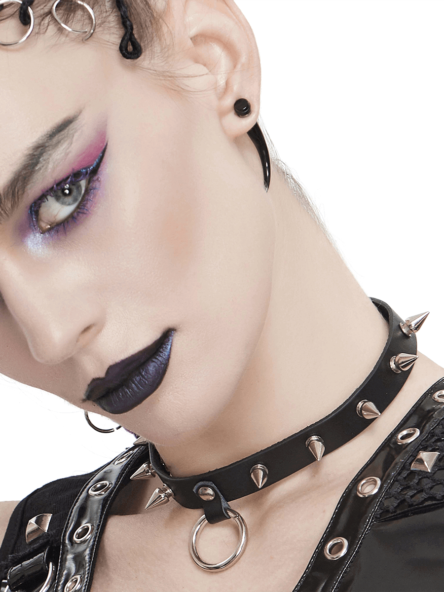 Close-up of a model wearing a Gothic punk black leather choker with spikes and an O-ring, showcasing edgy style.