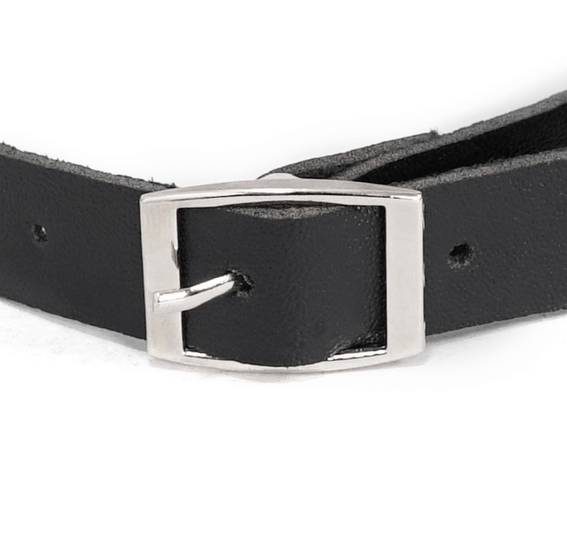 Close-up of a black leather choker with a silver buckle, perfect for gothic punk fashion enthusiasts.