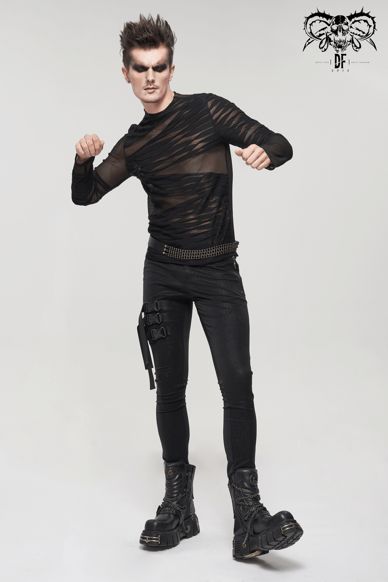 Stylish male model in a Gothic Punk transparent long sleeve black top, paired with slim black pants and edgy boots.
