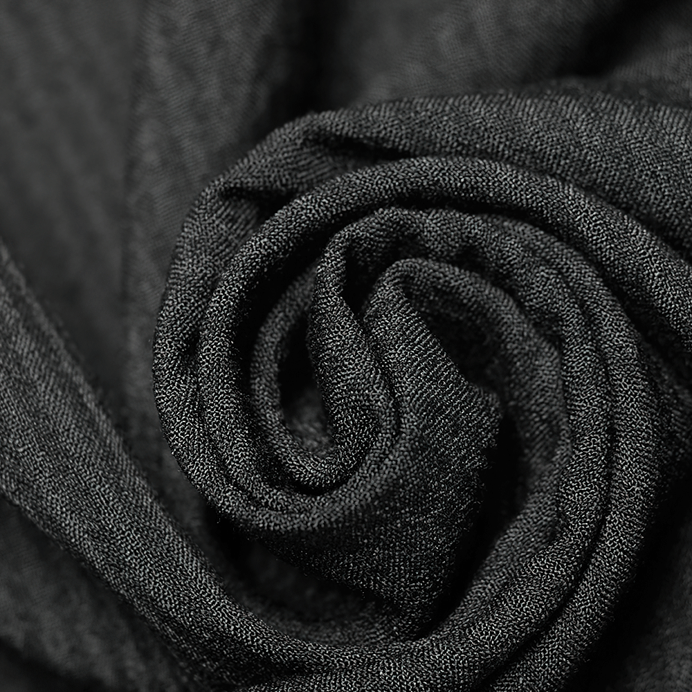 Close-up of luxurious black fabric, perfect for gothic punk fashion and accessories.