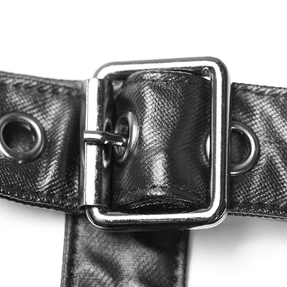 Close-up of a black leather strap with metal buckle and eyelets for a gothic punk fashion style.