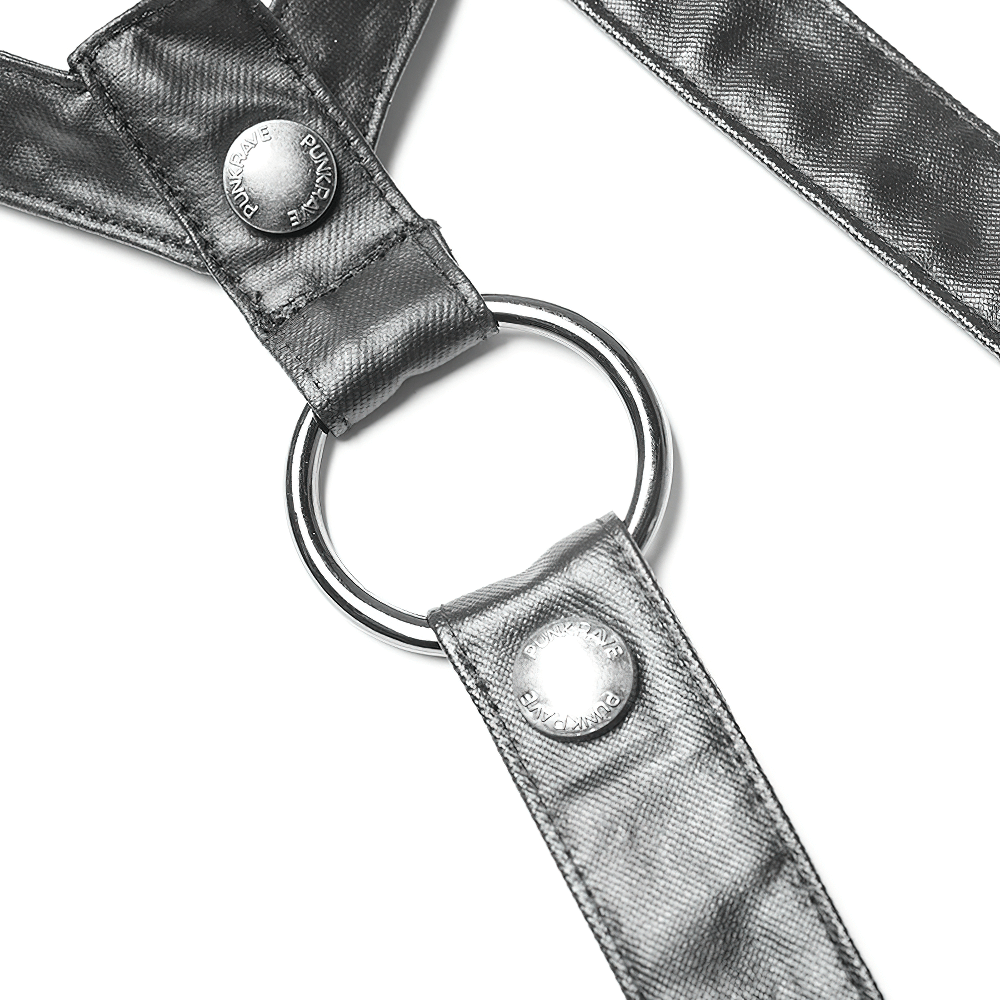 Close-up of a striking black harness with metal ring and shiny buckles for a gothic punk look.