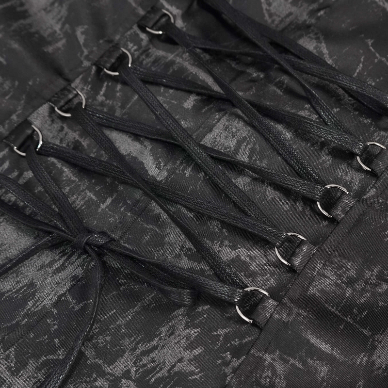 Close-up of the lace-up detail on a gothic punk women's coat, featuring black strings and metal rings.