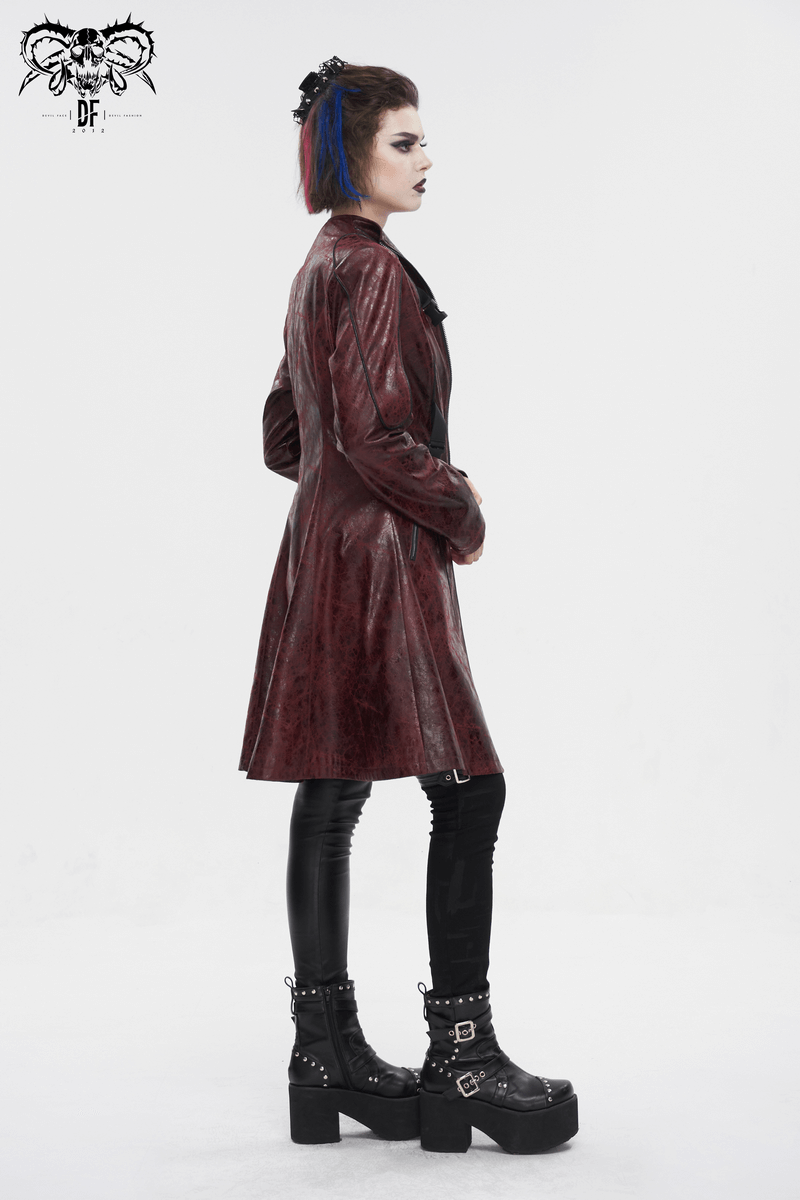 Gothic punk woman in a mid-length faux leather coat with an edgy look and stylish platform boots.