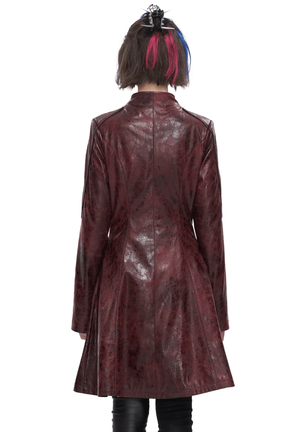 Back view of a woman in a gothic punk mid-length faux leather coat with a stylish design.