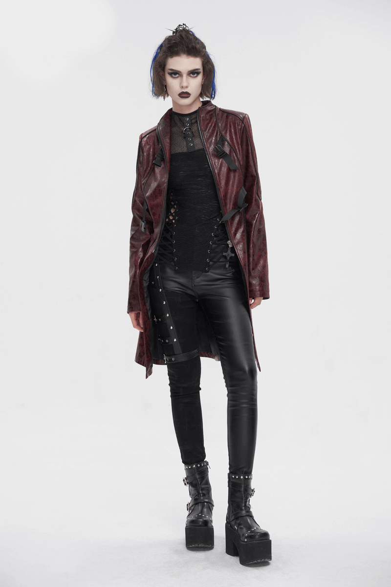 Gothic punk mid-length faux leather coat with double buckles, styled with edgy black pants and platform boots.