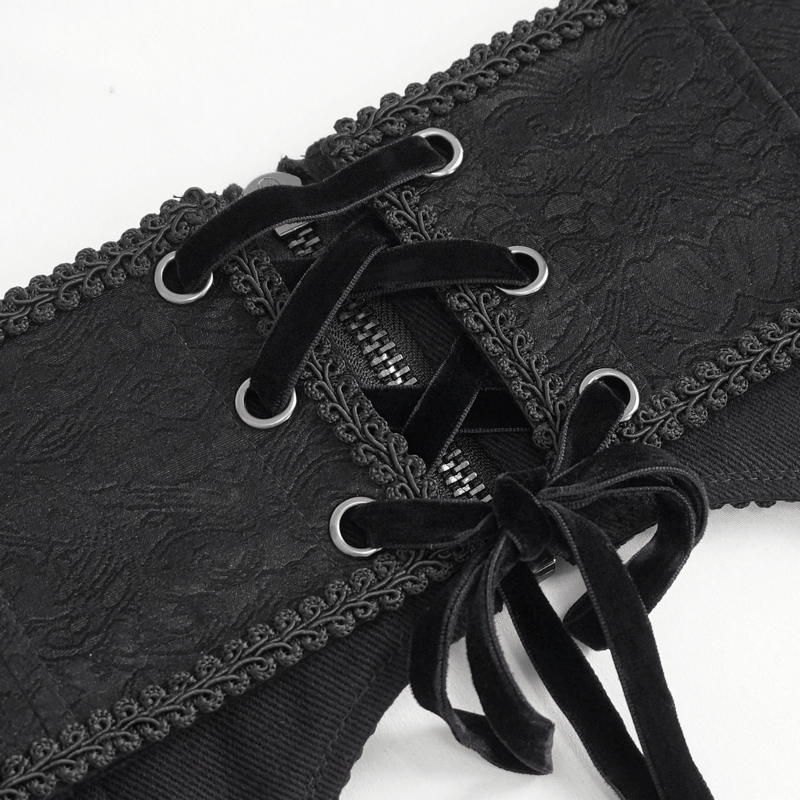 Close-up of a black gothic punk girdle with zippers and lace detailing showcasing edgy fashion.